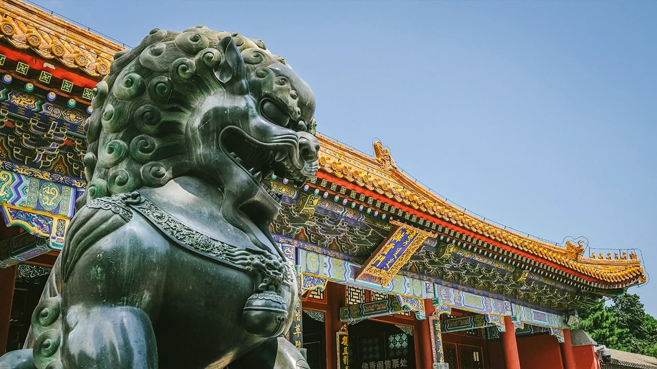 Bronze lion statue outside a palace, Beijing