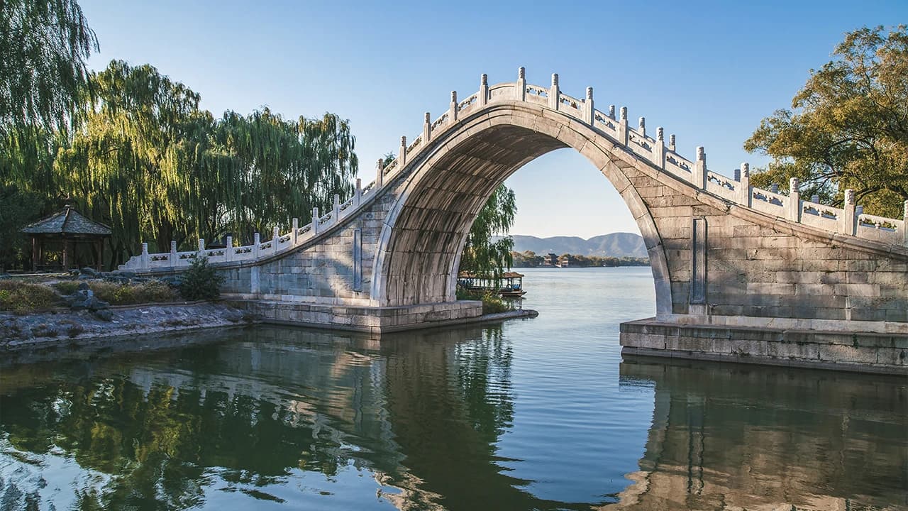 Stone arch bridge over a lake at the Summer Palace