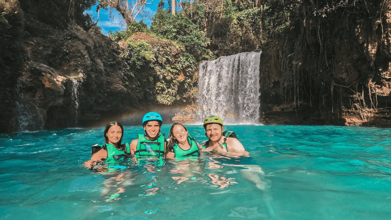 Travelers at a canyon waterfall in Moalboal, Philippines